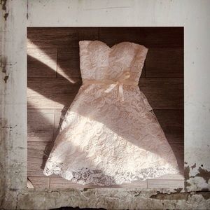 Cream-colored, strapless, lace dress w zip in back